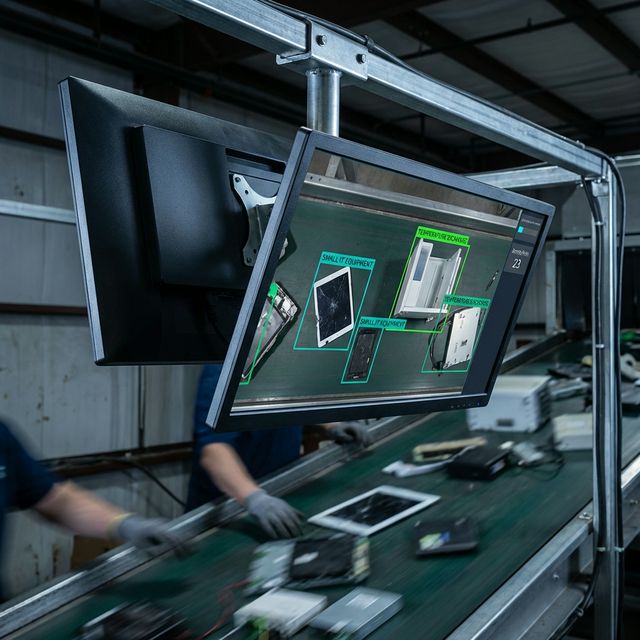 Close-up of industrial display showing real-time WEEE sorting guidance interface